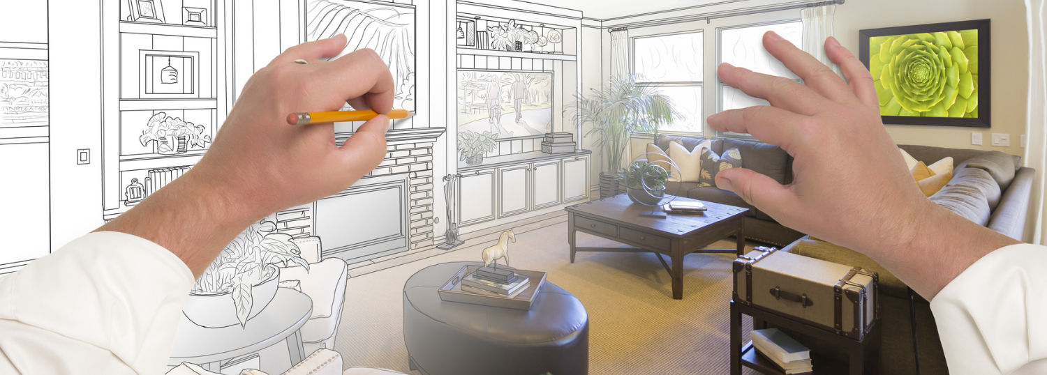 A man's hands sketching a living room that is turning into a real photo