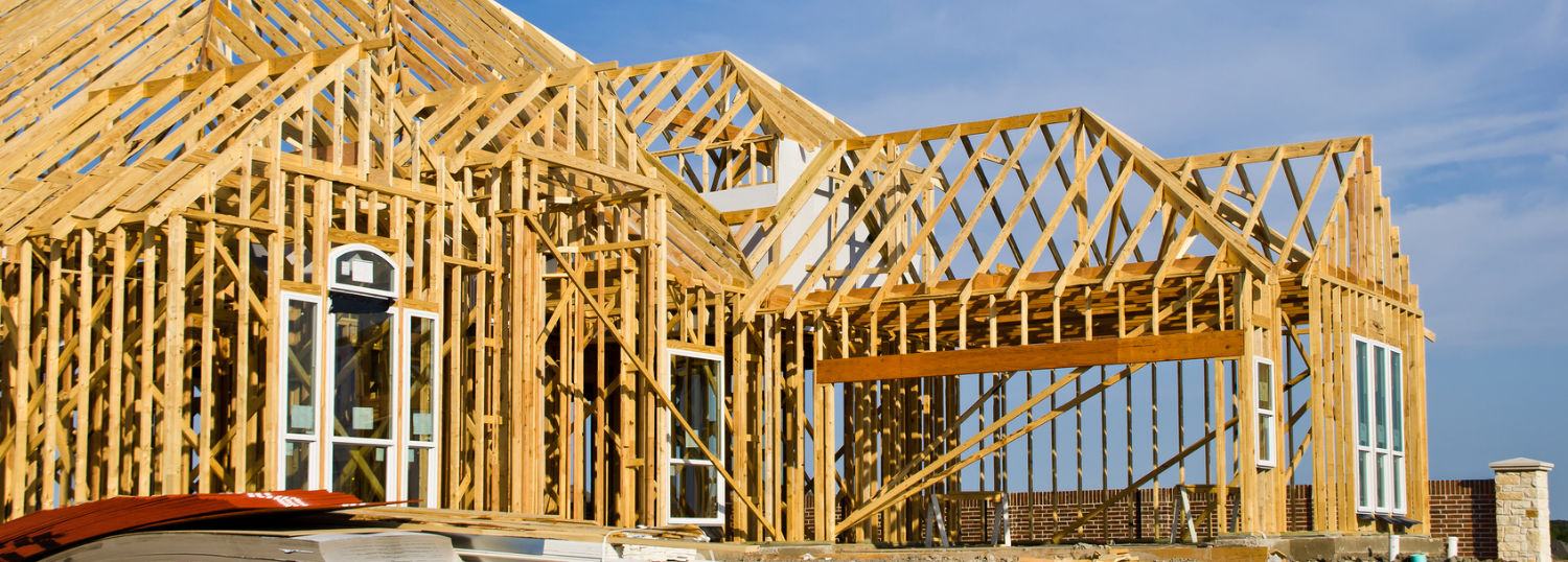 Beautiful house framing with peaked roof rafters