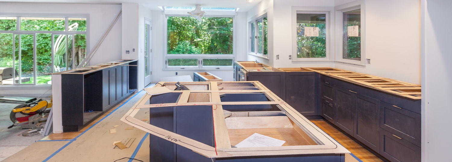 Expansive custom kitchen cabinets in the process of remodeling