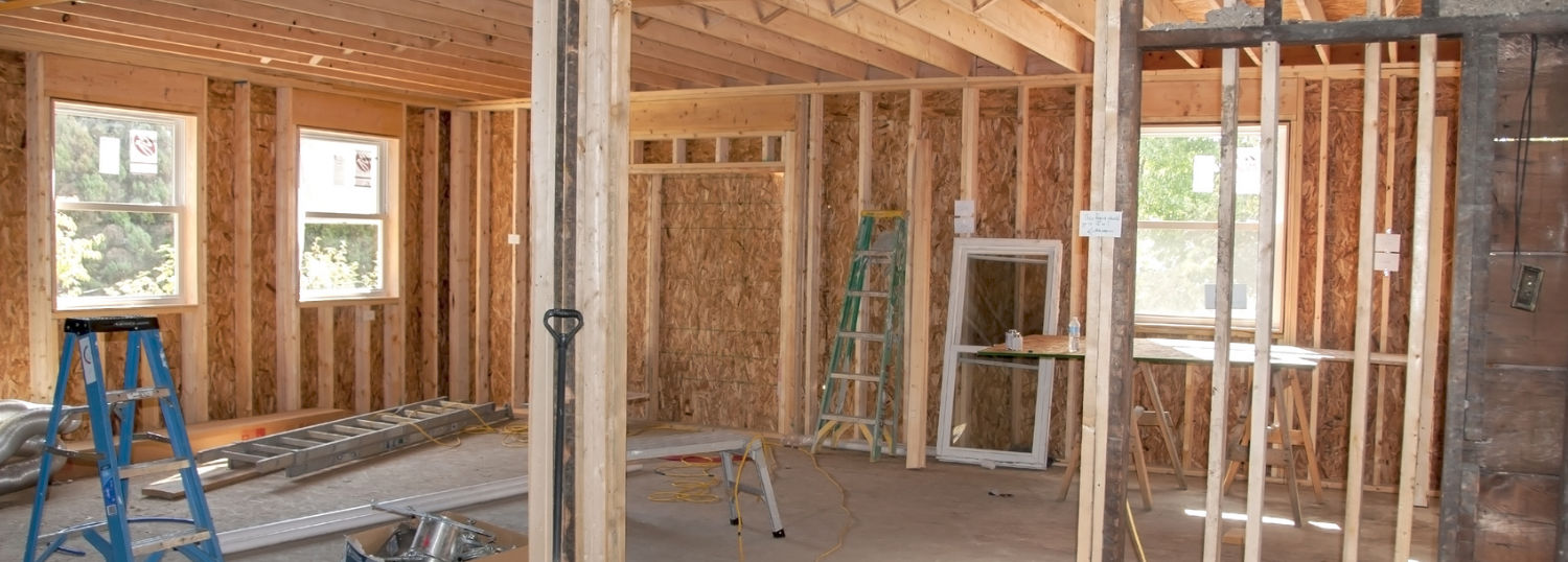 Plywood walls and windows going up in a new room